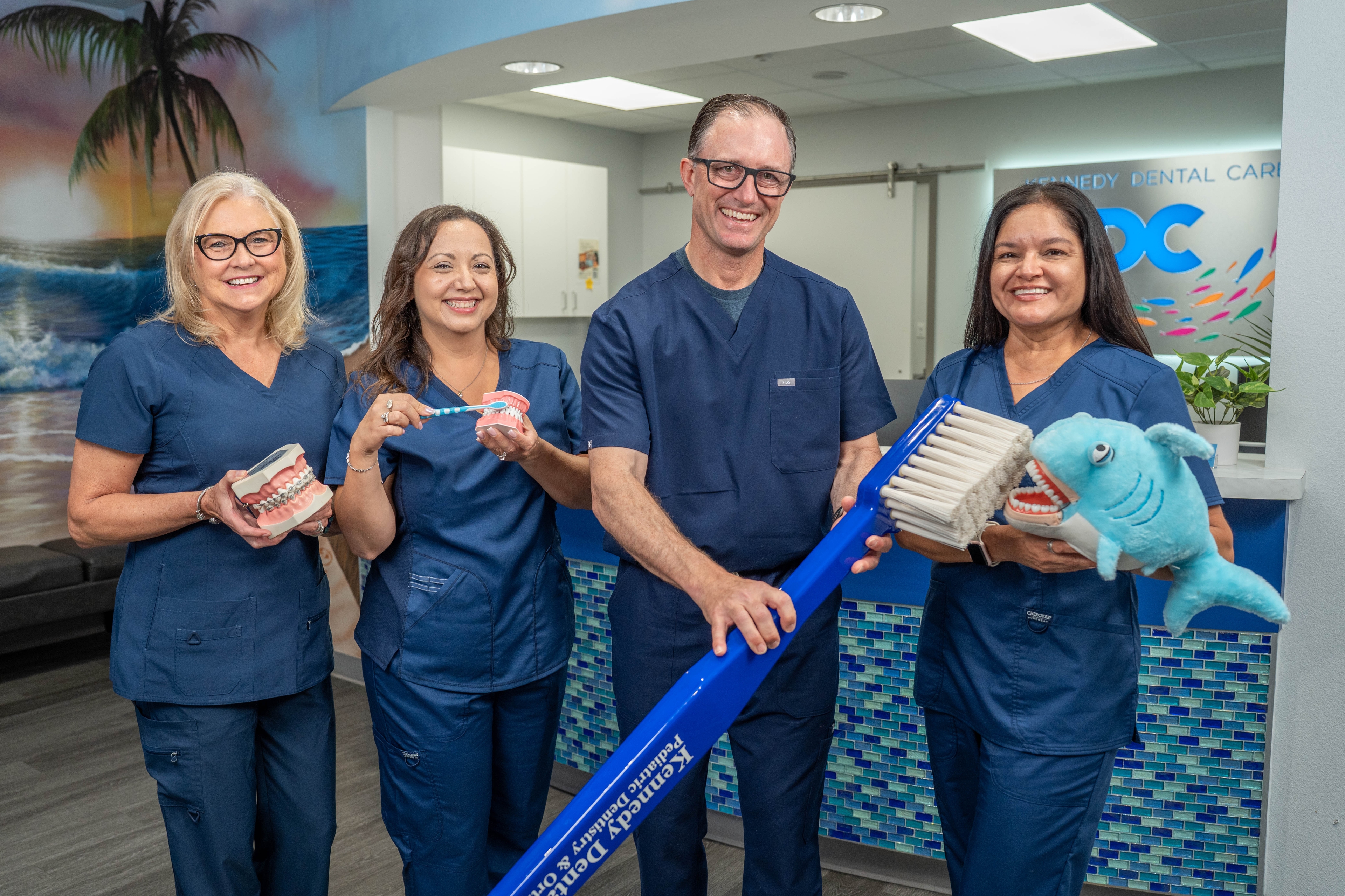 Kennedy Dental Care team member caring for a child