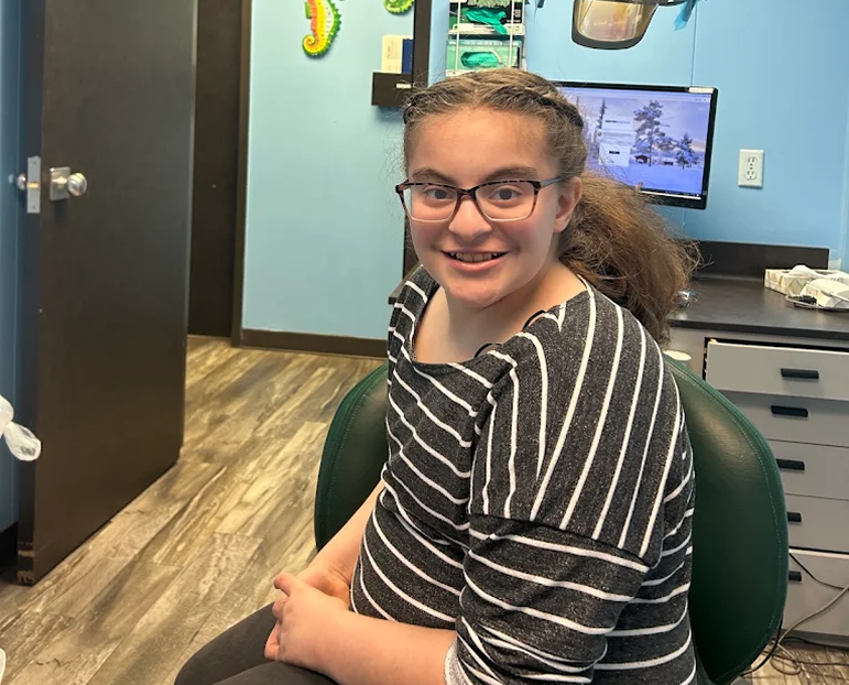 Team member with a young patient at the Alameda office
