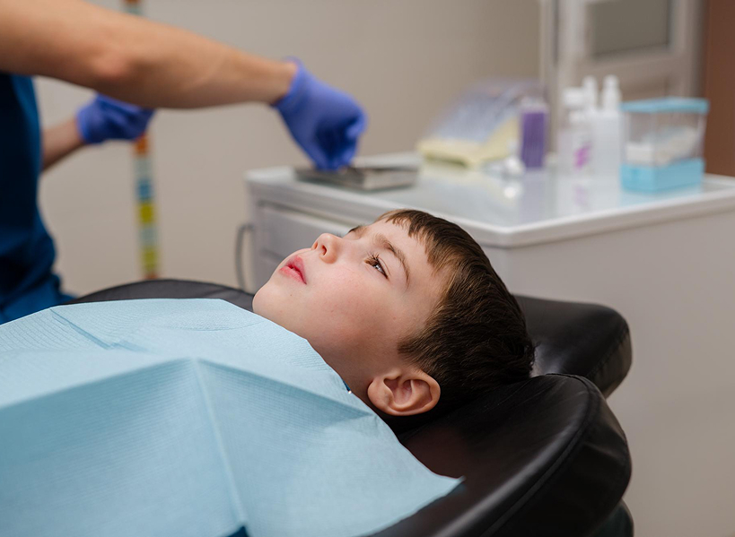 A Kennedy Dental Care team member with a young patient