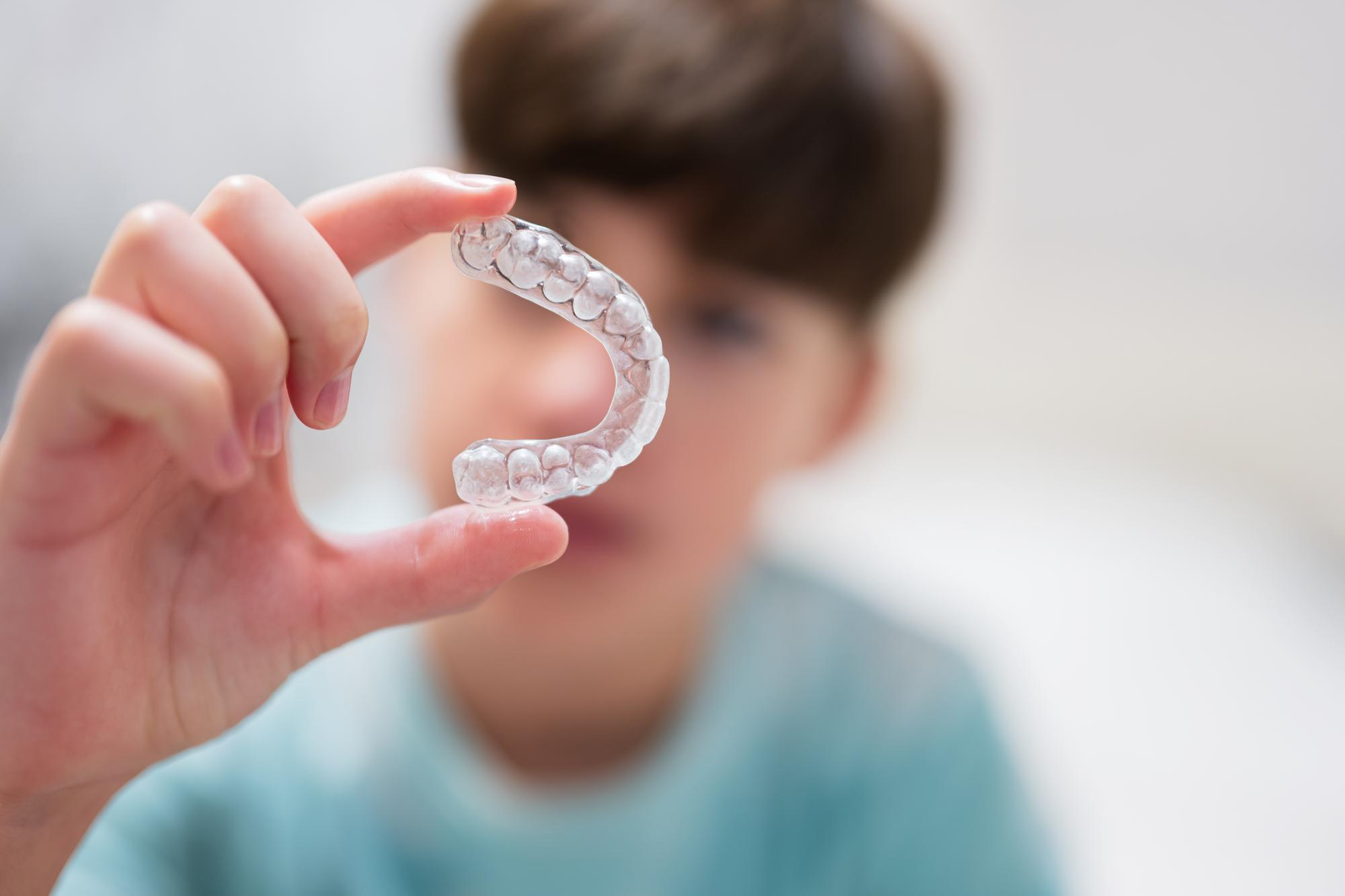 A teen considering Invisalign versus braces