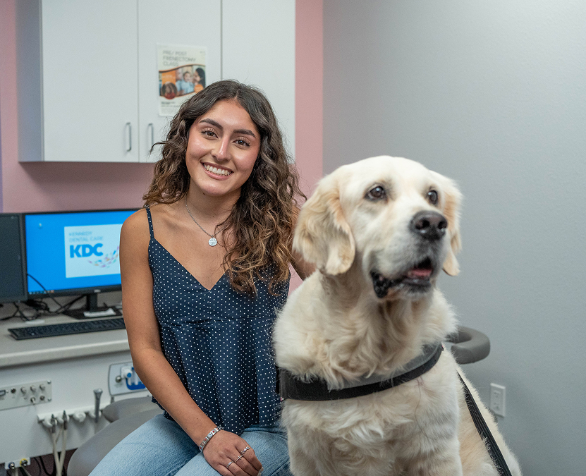 A young patient exploring the treatment room with a team member